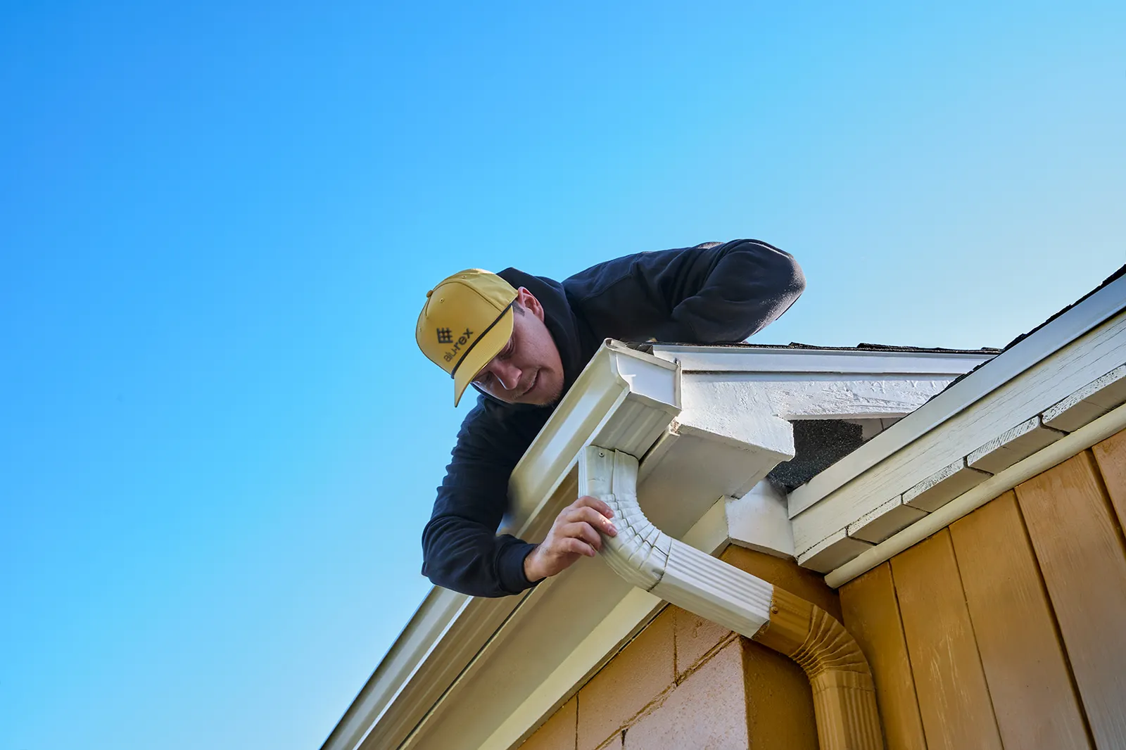 Seamless gutters and soffit around a bay window — JoLee Exteriors Ltd, Parksville BC